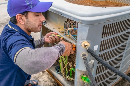 Gallagher's Plumbing, Heating & Air Conditioning - HVAC Technician performing an AC tune-up